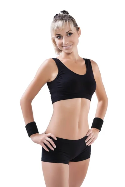 Beautiful sports female posing with hands on hips looking at cam — Stock Photo, Image