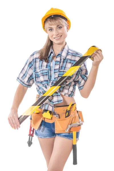 Beautyful sexy female construction worker holding caution tape — Stock Photo, Image