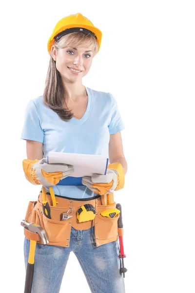 Beautyful young female worker with many tools holding clipboard Royalty Free Stock Images