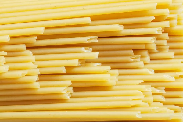 Uncooked Italian spaghetti top view — Stock Photo, Image