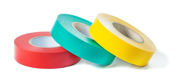 Red blue yellow rolls of insulation tape isolated on white backg — Stock Photo, Image