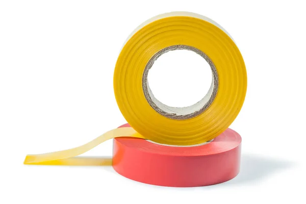 Червоні та жовті рулони ізоляційної стрічки ізольовані на білому — стокове фото