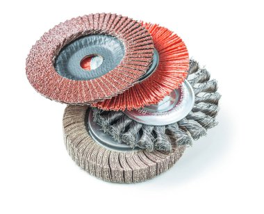 stack of abrasive tools greending flap wheels isolated on white clipart