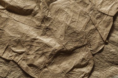 Yüksek çözünürlüklü buruşmuş kahverengi kağıt dokusu kapat