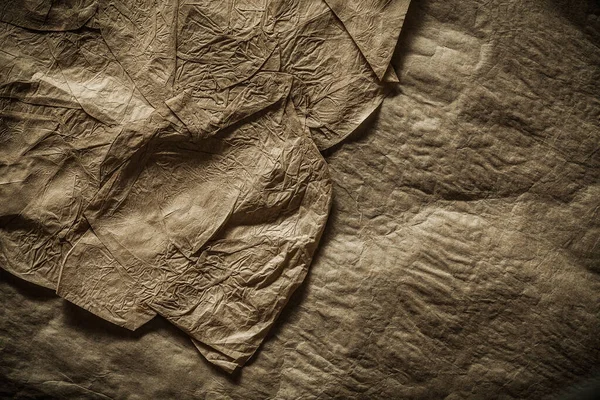 Зім'ята старовинна коричнева текстура паперу крупним планом — стокове фото