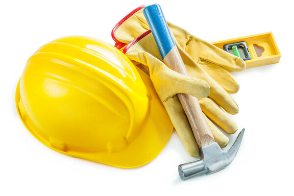 hammer in gloves helmet and construction lvel isolated