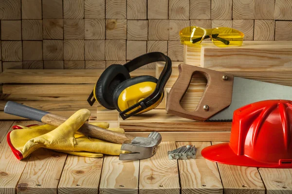 Carpentry Tools Goves Helmet Goggles Hammer Handsaw Earphones Nails Handsaw — Stock Photo, Image