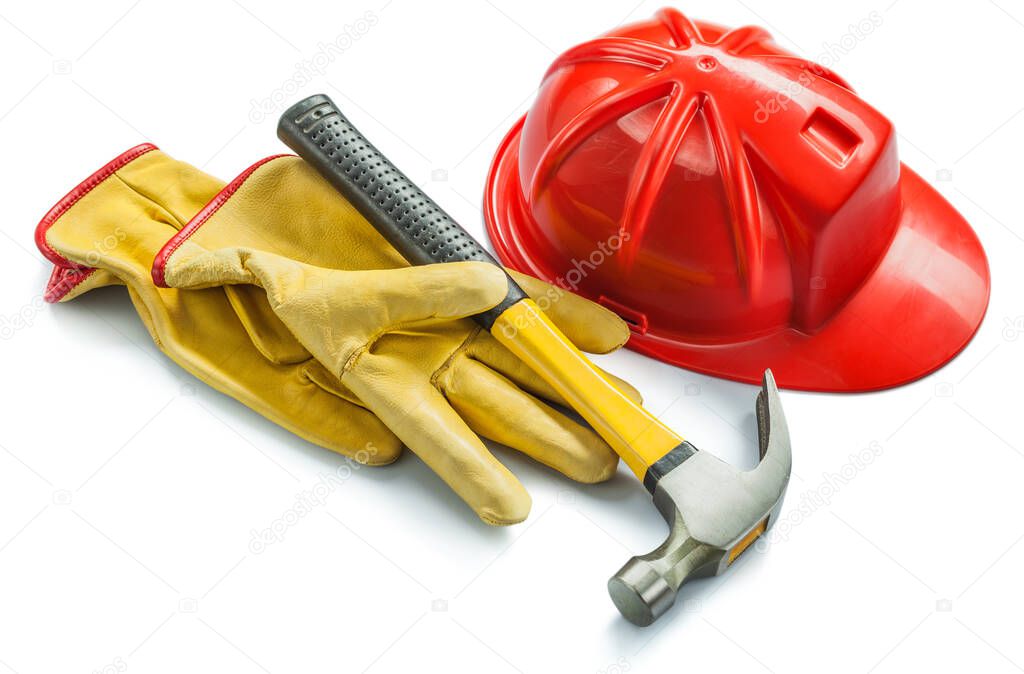 construction tools yellow leather gloves red helmet and hammer iswolated on white