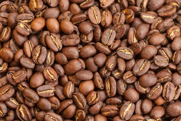 Roasted brown coffee beans as background — Stock Photo, Image