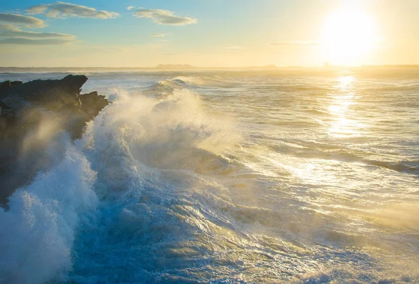 Rocky beach at sunset — Stock Photo, Image