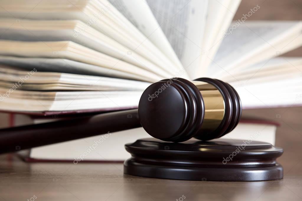 wooden gavel and books 