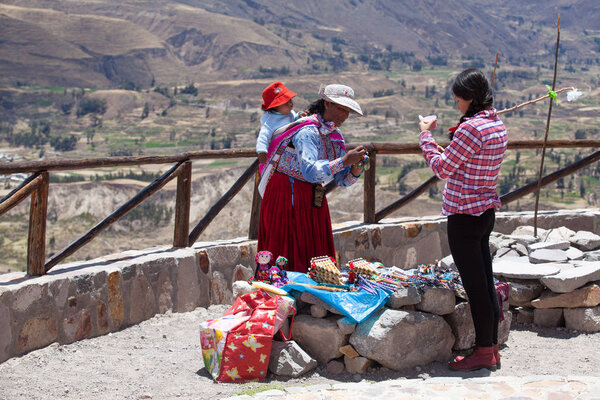 Unidentified women selling souvenirs