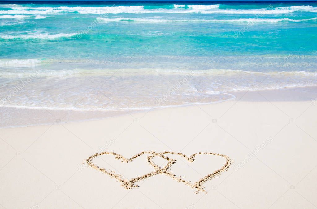 hearts drawn on the sand