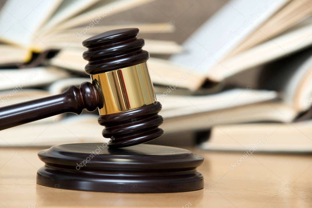 wooden gavel and books 