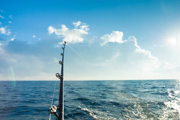 Fishing rod with blue ocean — Stock Photo, Image