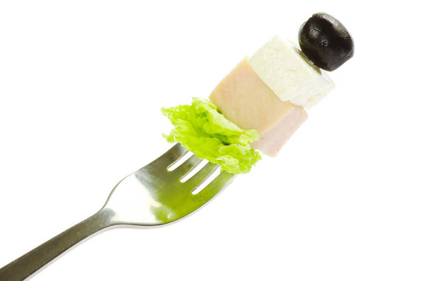 Fresh vegetables on fork