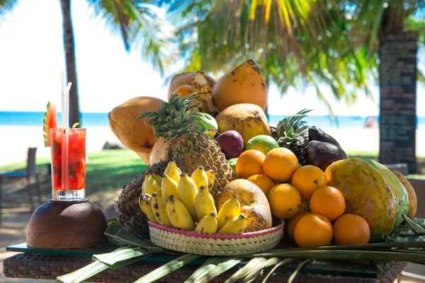 Cocktail with assorted fruits on table — Stock Photo, Image