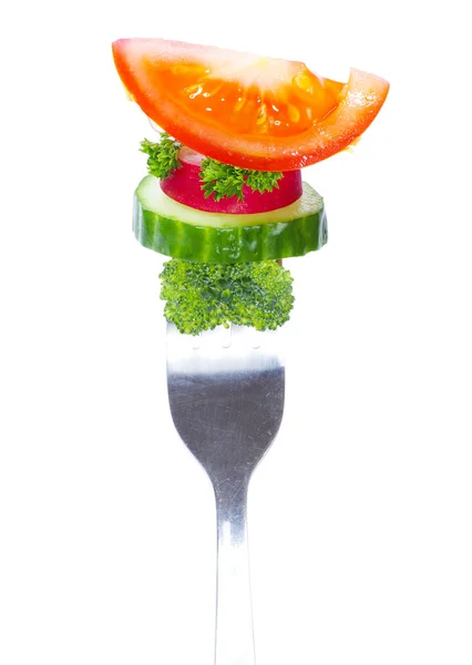 Färska grönsaker på gaffeln — Stockfoto
