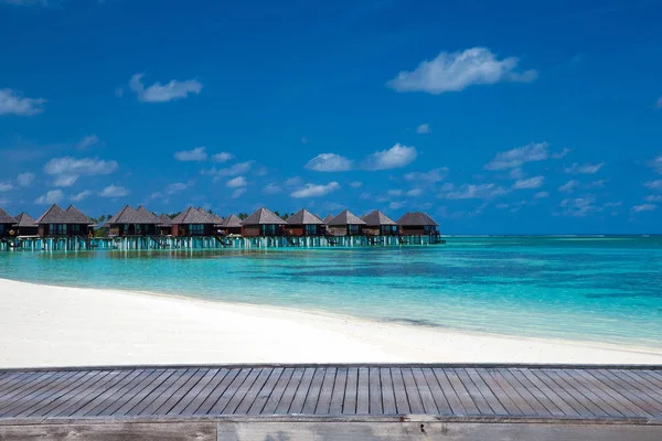 Beach with water bungalows — Stock Photo, Image