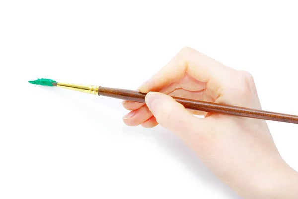 Photo of a brush in a hand — Stock Photo, Image