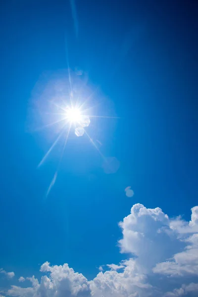 Blue sky with clouds and sun — Stock Photo, Image