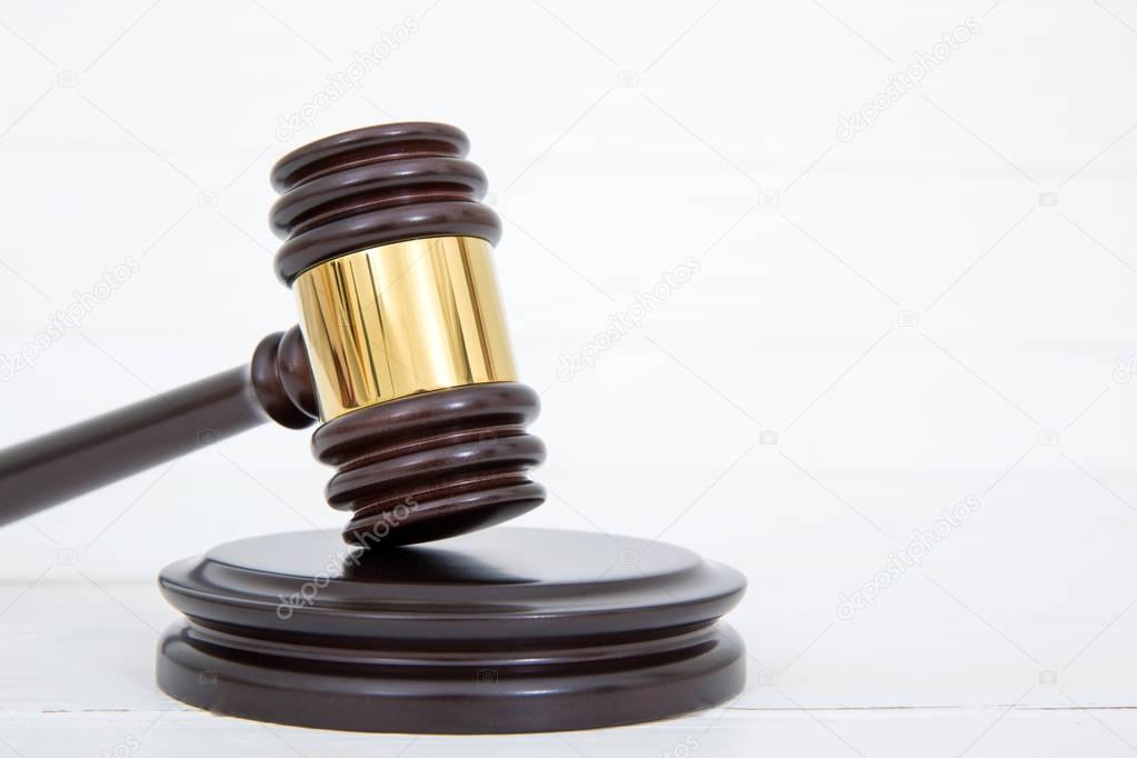 Judges gavel and sound block on wooden background