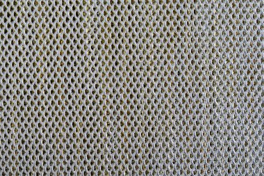 arka plan sayfası dairesel delikli çizgilerle kaplanmış metal