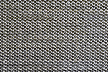 arka plan sayfası dairesel delikli çizgilerle kaplanmış metal