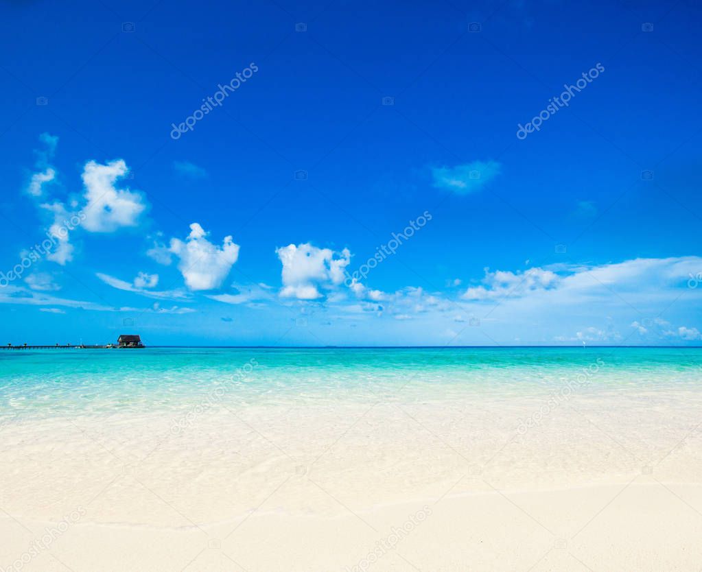 Tropical beach with clean sea and blue sky 