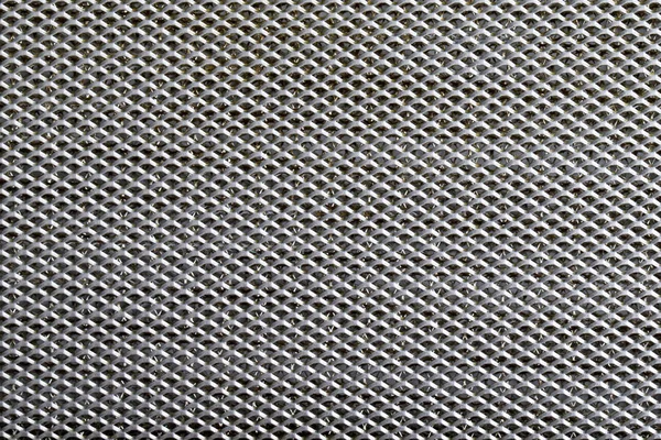 円形の穴の線で覆われた金属のバック グラウンド シート — ストック写真