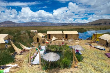 traditional buildings on Titicaca lake near Puno, Peru clipart