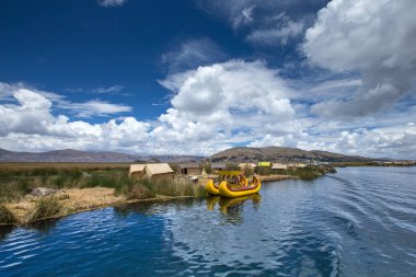 Totora boats on Titicaca lake near Puno, Peru clipart