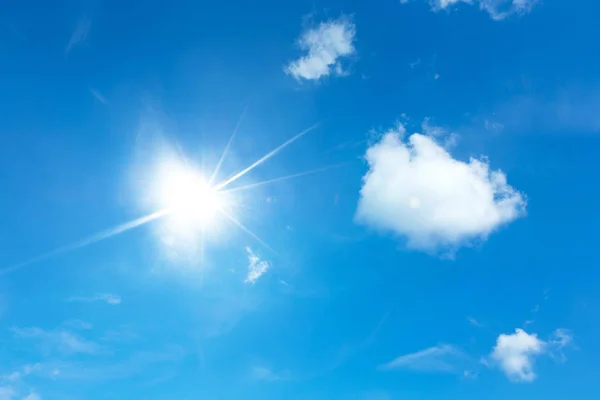 Blue sky with white clouds. Sun in sky — Stock Photo, Image