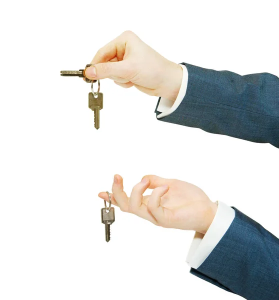 Hand holds a key isolated on white — Stock Photo, Image