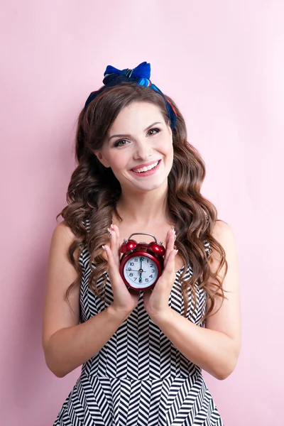 Close-up portrait of young beautiful slim sexy young woman in a retro pin-up style in sexy dress with red sensual lips on pink background — Stock Photo, Image