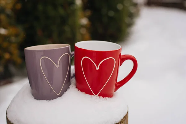 Valentines day concept with hearts and cups over nature Stock Picture