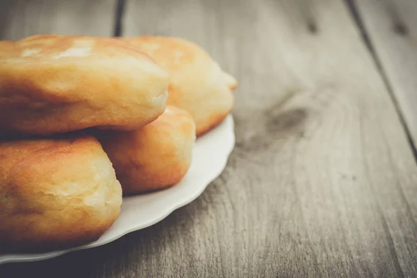 Fresh baked homemade buns on the table — Stock Photo, Image