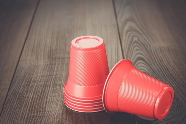 stack of red plastic cups on the table