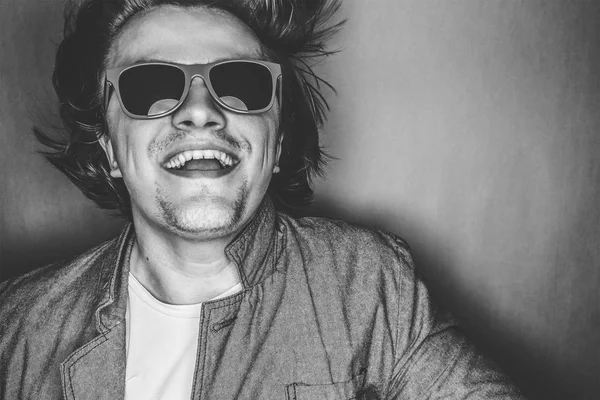 Closeup portrait of a casual young man with sunglasses — Stock Photo, Image