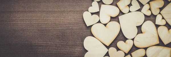 Wooden heart shapes on the table — Stock Photo, Image