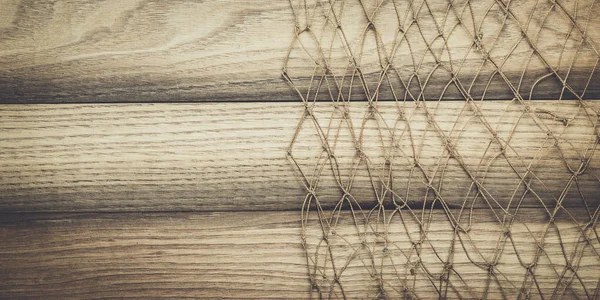 Textura de fundo de madeira e rede de pesca — Fotografia de Stock