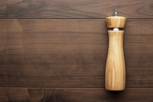 Wooden salt shaker on the table — Stock Photo, Image