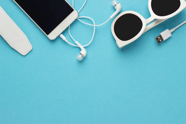 Studio shot of white accessories on blue — Stock Photo, Image