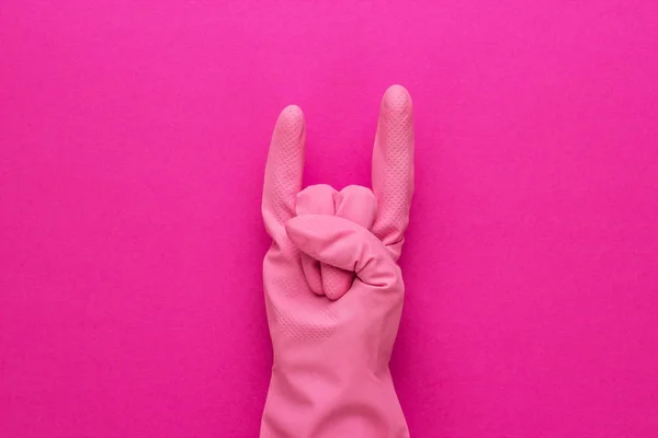 hand in pink protective glove
