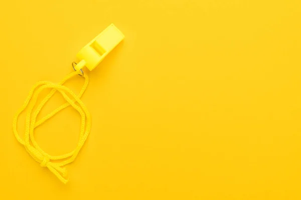 Plastic yellow whistle — Stock Photo, Image