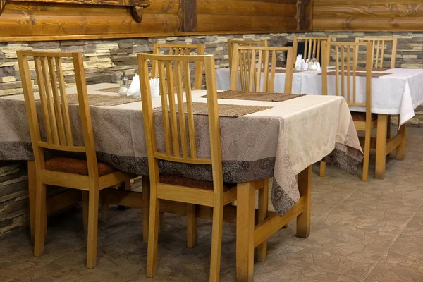 Interior of a cafe in a wooden house — Stock Photo, Image