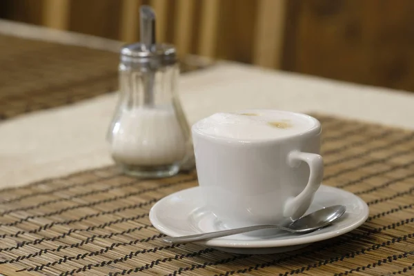 Xícara de um café em uma mesa — Fotografia de Stock