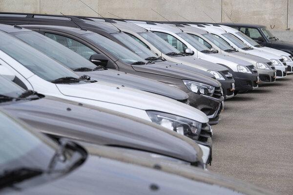 New cars on a parking in car dealership