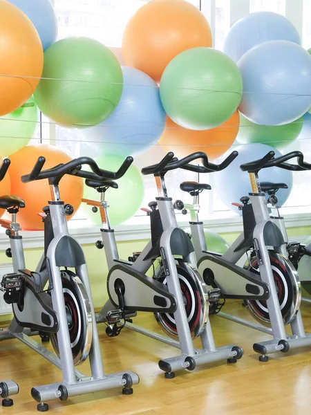 Interior of fitness hall with fitness bicycles — Stock Photo, Image