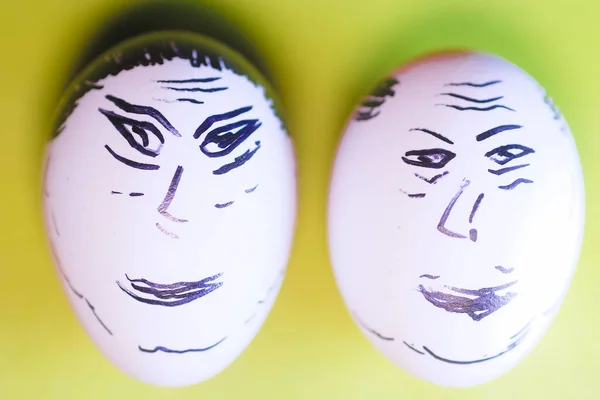 Two faces drawing on an egg